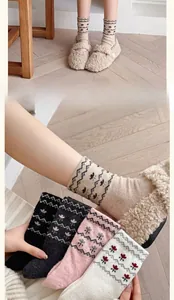 Detail of wool Fair Isle socks with retro geometric patterns for women in autumn
