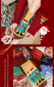 Close-up of Christmas cotton socks with cute cartoon Santa, reindeer, and snowman patterns