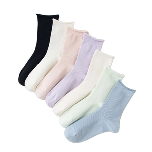 Set of 7 colorful ribbed cotton crew socks for women featuring minimalist rolled cuff design