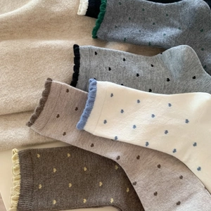 Thick winter wool socks featuring heart polka dots and elegant ruffled edges in earth tones