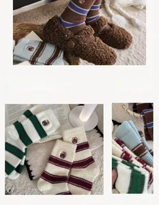Detail of warm striped fuzzy socks with Teddy embroidery patches and cozy plush texture