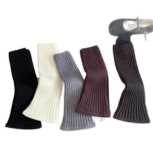 Winter knitted leg warmers in various colors featuring ribbed texture and warm fabric