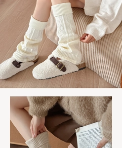 Detail of cable knit white leg warmers paired with plush faux shearling mule shoes