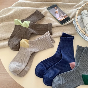 Cozy autumn winter wool socks in vintage colors with thick ribbed knit texture
