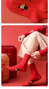 Detail view of red cotton socks with embroidery for Lunar New Year and Year of the Horse