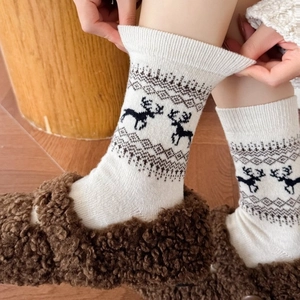 Winter Fair Isle wool socks for women with reindeer pattern and warm knit texture