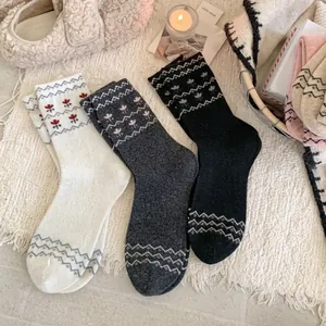 Three pairs of vintage Fair Isle wool blend socks with floral embroidery and Nordic patterns