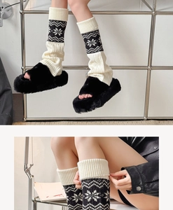 Close-up of Fair Isle knit leg warmers with snowflake patterns and plush faux fur slippers