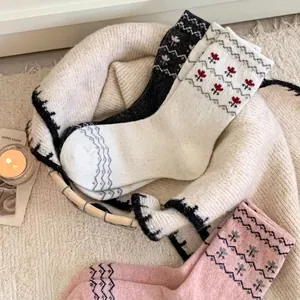 Three pairs of vintage Fair Isle wool knit socks with floral jacquard patterns