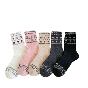 Five pairs of vintage Fair Isle wool socks in assorted colors with geometric patterns