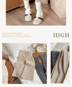 Detail of cable knit leg warmers in white, beige and grey with soft textured knit patterns