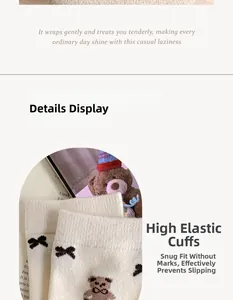 Close-up of ribbed elastic cuff on white knit socks with cute brown bear pattern
