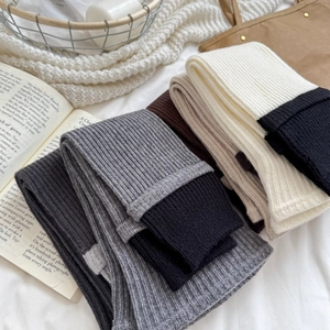 Winter striped knitted leg warmers in grey patchwork design for a stylish look