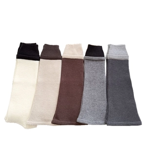 Winter rib-knit leg warmers in various colorblock styles for leg shaping and warmth