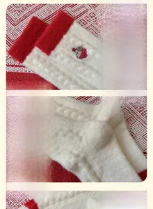 Detail of soft plush socks showing elastic ribbed cuffs and embroidered bear pattern