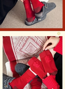 Detail of red festive cotton socks with knit characters and grey felt slippers