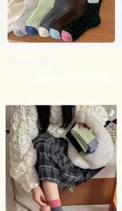 Detailed knit texture of wool-blend warm socks in various colors with contrast toe design
