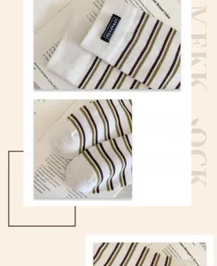 Detail view of striped cotton socks with a handmade label and seamless toe reinforcement