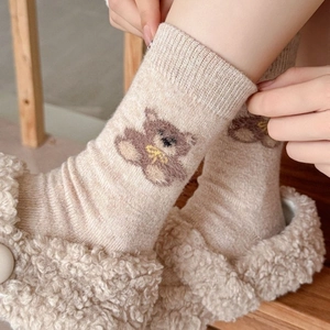 Cozy beige wool crew socks featuring cute cartoon bear patterns with fleece slippers