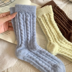 Three pairs of thick cable knit thermal socks in blue, yellow, and brown wool blend
