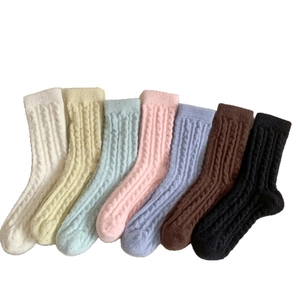 Thick wool blend mid-calf socks in seven colors with cable knit texture for winter