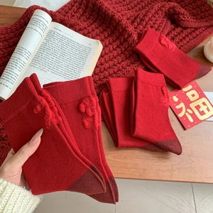 Red knit Year of the Horse socks with 3D floral texture and deep red contrast toe
