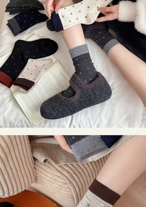 Detail of floral embroidery on wool socks with warm cozy interior lining