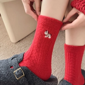Thick red thermal Christmas socks with cute dog embroidery shown on model for winter