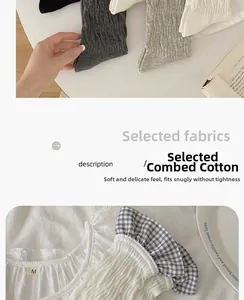 Detailed view of combed cotton crew socks texture and plaid ruffle collar top