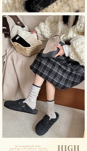 Close-up of thick winter wool socks with contrast cuffs and woven lucky label detail