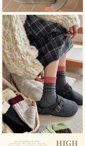 Detailed knit texture of thick wool socks in various color combinations for winter