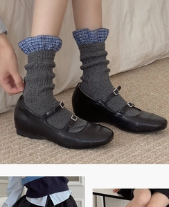 Classic black Mary Jane shoes with double straps paired with grey ribbed cotton socks