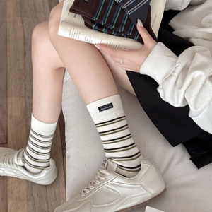 Retro striped crew socks in cream with brown stripes and handmade fabric label detail