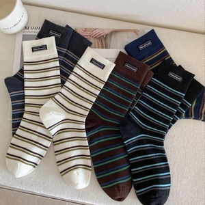 Retro striped crew socks in various colors with handmade label on premium cotton fabric