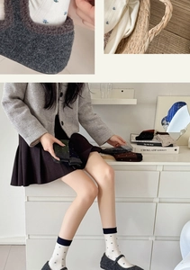 Detail shot of French floral wool socks with reinforced toes and soft knit texture