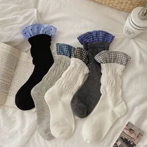 Five pairs of vintage cotton mid-tube socks with contrast ruffled edges in soft neutral tones