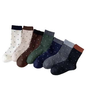 Set of wool blend crew socks with floral embroidery in seven diverse colors