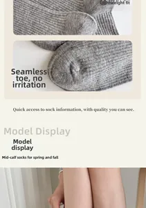 Detailed view of seamless toe stitching and knit texture on grey crew socks