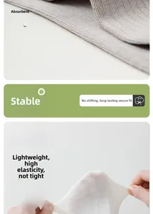 Close-up of gray and beige cotton socks showing high elasticity and breathable fabric texture