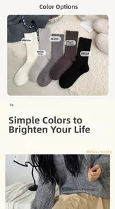 Detailed close-up of thick ribbed wool-like socks in white, beige, brown, and black tones