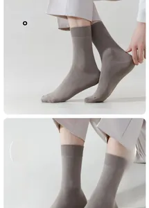 Detail of grey mid-calf cotton socks showing seamless toe stitching for extra comfort