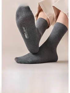 Detail of grey cotton socks showing antibacterial texture and 300 washes durability test