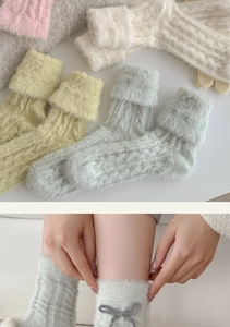 Detail view of winter bow socks in plush coral fleece and assorted macaron colors