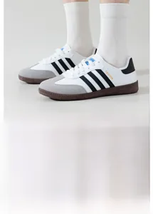 Detail view of retro casual sneakers featuring synthetic leather and suede patchwork finish