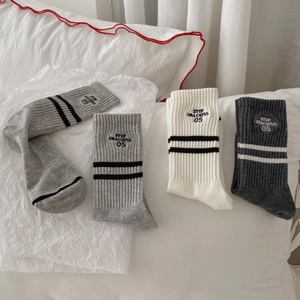Set of three striped cotton mid-tube socks with embroidered letters in neutral tones