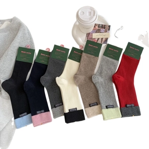 Set of 7 colorful ribbed cotton crew socks with handmade labels and contrast trim
