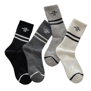 Striped cotton crew socks set in black and grey with Step Graceful letter embroidery