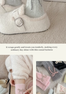 Detail of plush mink velvet bow socks with cozy textured knit for winter comfort