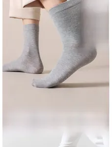 Detailed view of light grey ribbed cotton crew socks with reinforced anti-slip heel design