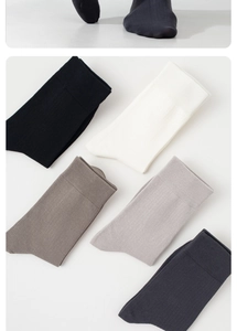 Detailed fan display of cotton mid-tube socks in black, white, khaki, grey and navy blue
